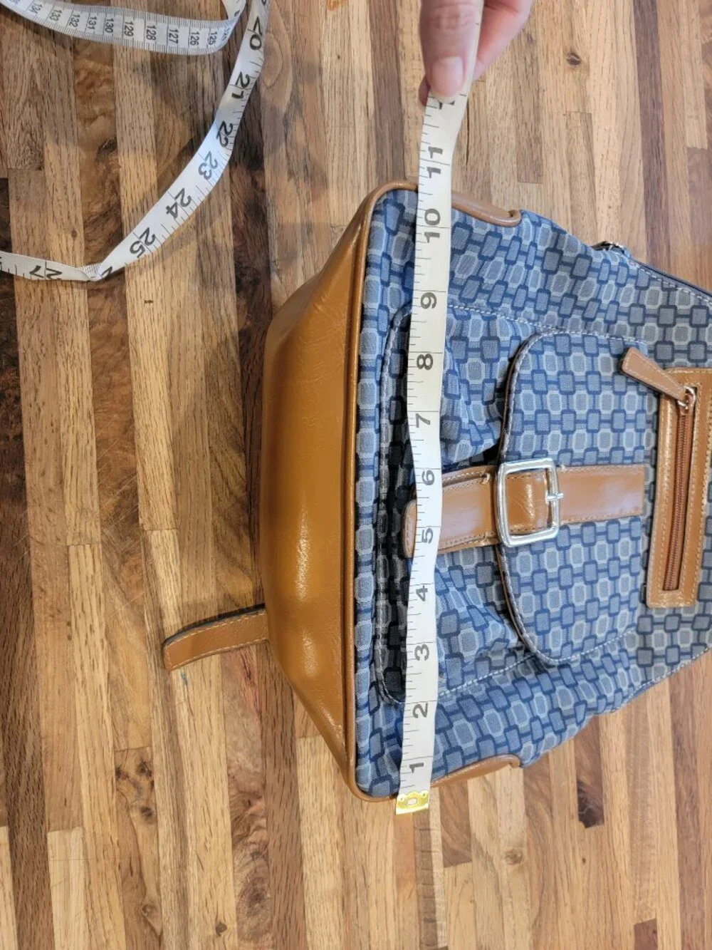 Nine West backpack purse featuring a geometric pattern and brown faux leather tr
